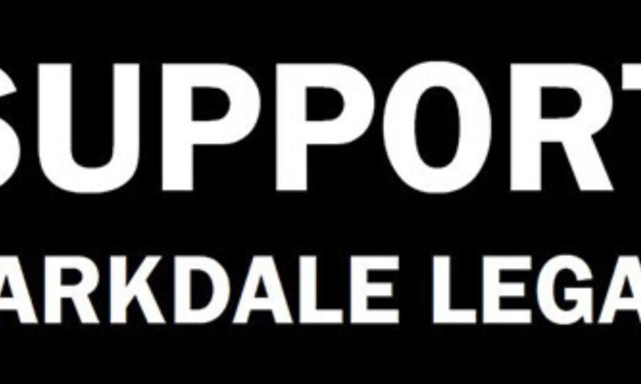 White text on a black background reads "SUPPORT PARKDALE LEGAL" in bold, uppercase letters.