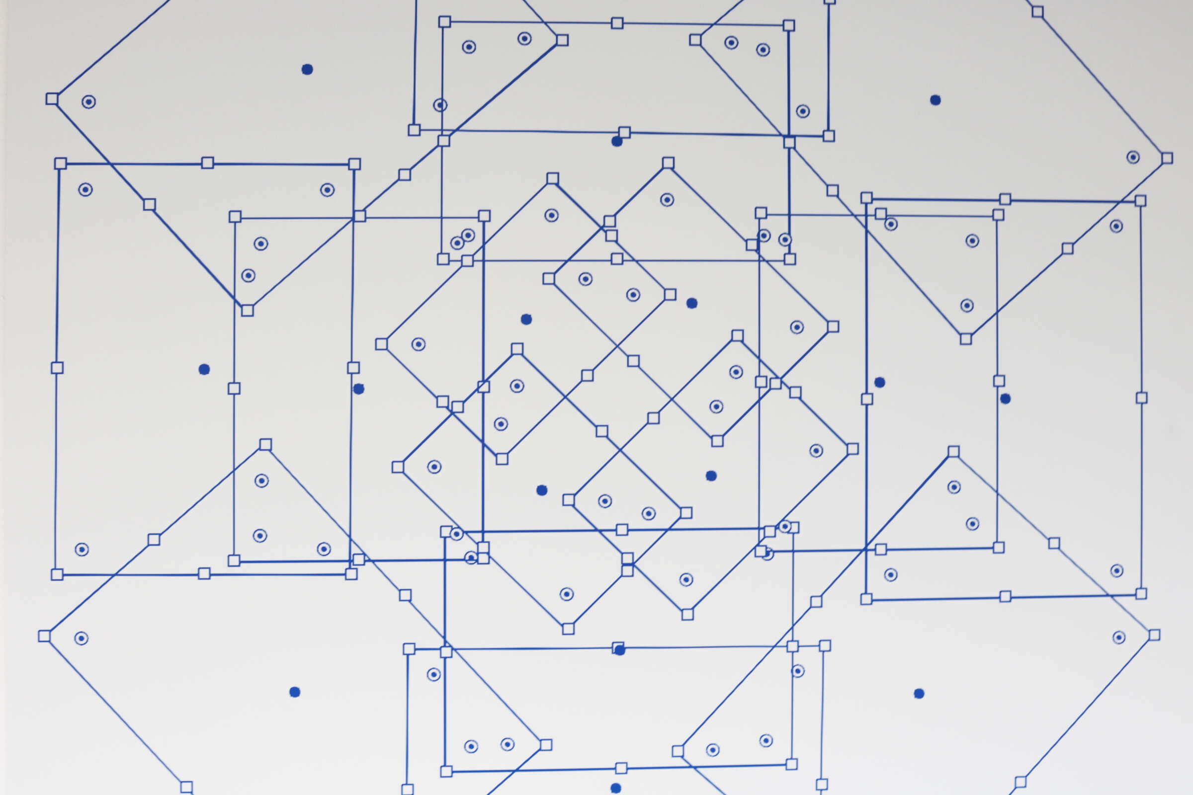 A white background features a geometric pattern composed of interconnected blue lines and shapes, including squares, diamonds, and triangles. Small blue dots and squares are interspersed within and around the pattern.